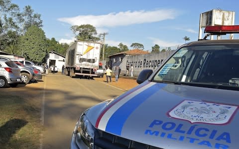 A refrigerated truck arrives at the Regional Recovery Center in Altamira, Para state, Brazil after a riot broke out between rival gangs at the Regional Recovery Center - Credit: KAIO MARCELLUS/Rex