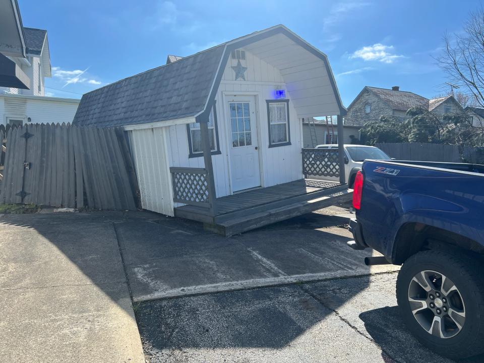 An outbuilding at Katona Realty was lifted off the ground, along with a truck occupied by Louis Katona, during a possible tornado Wednesday.