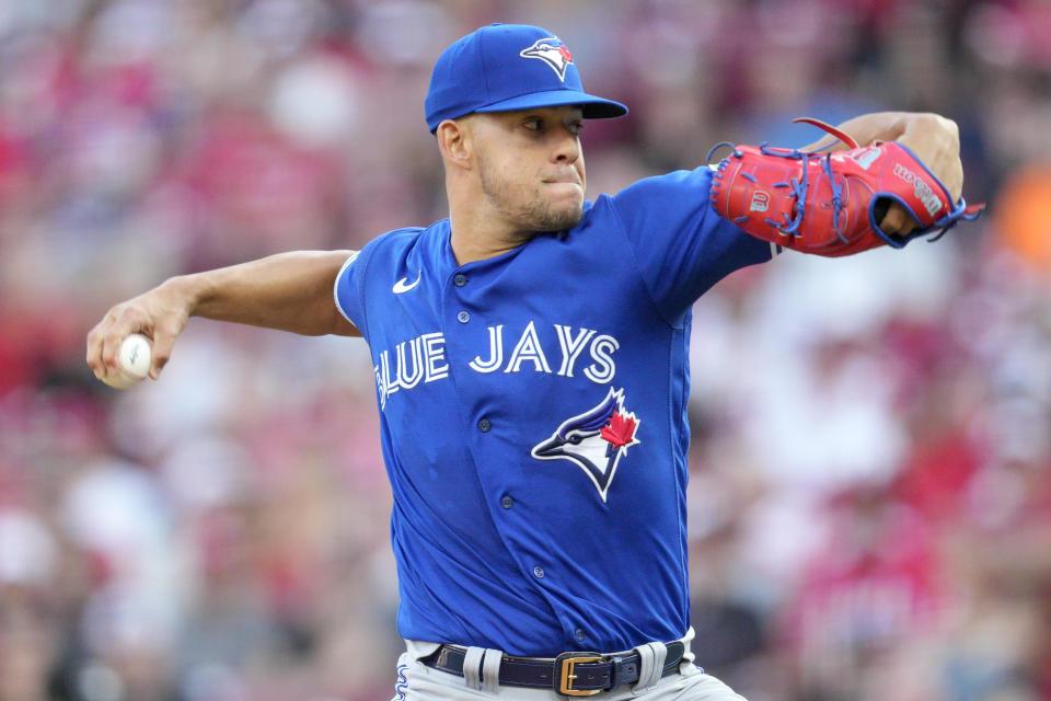 Toronto Blue Jays starting pitcher Jose Berrios throws against the Cincinnati Reds in the first inning of a baseball game in Cincinnati, Friday, Aug. 18, 2023. (AP Photo/Jeff Dean)