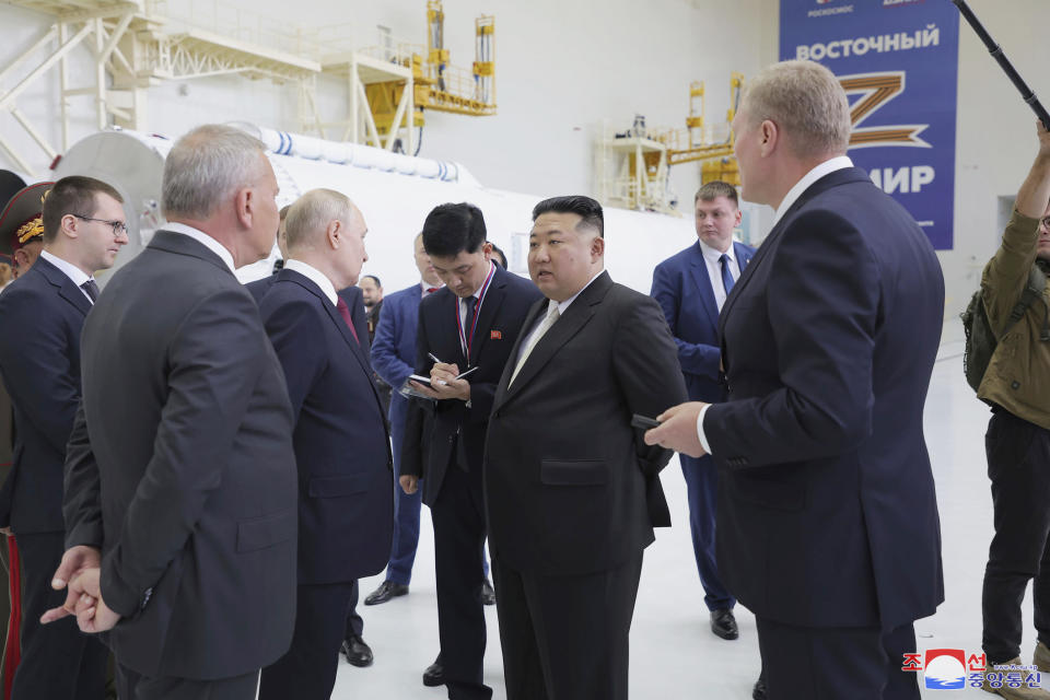 In this photo provided by the North Korean government, Russian President Vladimir Putin, third left, and North Korean leader Kim Jong Un, center, visit the Vostochny cosmodrome outside the city of Tsiolkovsky, about 200 kilometers (125 miles) from the city of Blagoveshchensk in the far eastern Amur region, Russia, Wednesday, Sept. 13, 2023. Independent journalists were not given access to cover the event depicted in this image distributed by the North Korean government. The content of this image is as provided and cannot be independently verified. Korean language watermark on image as provided by source reads: "KCNA" which is the abbreviation for Korean Central News Agency. (Korean Central News Agency/Korea News Service via AP)