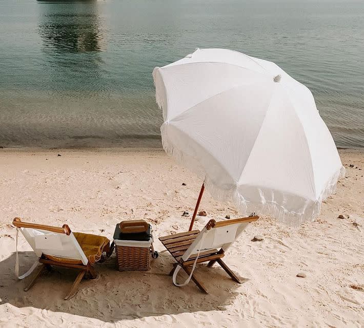 <p><a href="https://go.redirectingat.com?id=74968X1596630&url=https%3A%2F%2Fwww.potterybarn.com%2Fproducts%2Fst-tropez-beach-umbrella-mp&sref=https%3A%2F%2Fwww.countryliving.com%2Flife%2Ftravel%2Fg44188227%2Fbest-beach-umbrellas%2F" rel="nofollow noopener" target="_blank" data-ylk="slk:Shop Now;elm:context_link;itc:0;sec:content-canvas" class="link ">Shop Now</a></p><p>St. Tropez Fringe Umbrella</p><p>$199.00</p><p>potterybarn.com</p><span class="copyright">St.Tropez/Pottery Barn</span>