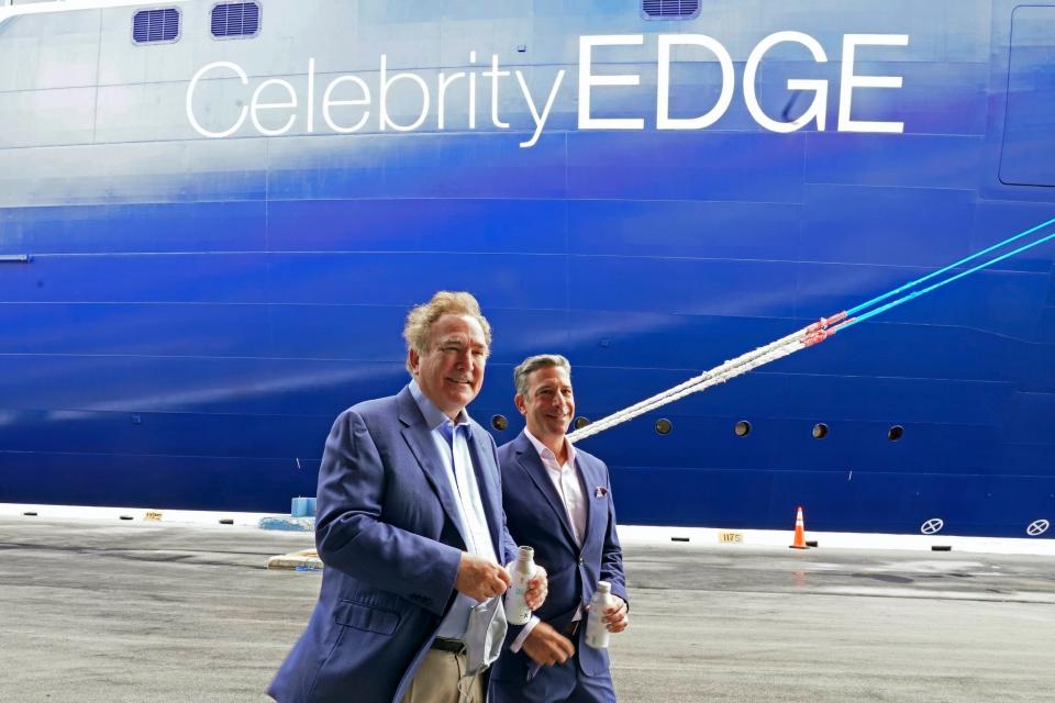 Richard Fain, Royal Caribbean Group's chairman and CEO, and Brian Abel, senior vice president of hotel operations and Celebrity Cruises, walking in front of the Celebrity Edge