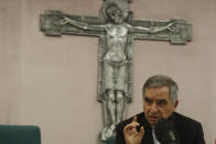 Cardinal Angelo Becciu talks to journalists during press conference in Rome, Friday, Sept. 25, 2020. The powerful head of the Vatican's saint-making office, Cardinal Angelo Becciu, has resigned from the post and renounced his rights as a cardinal amid a financial scandal that has reportedly implicated him indirectly. (AP Photo/Gregorio Borgia)