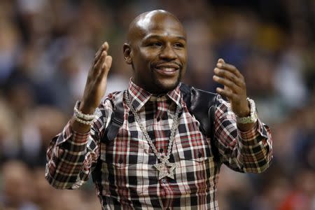 Boxer Floyd Mayweather cheers on the Boston Celtics during the fourth quarter against the Washington Wizards at TD Garden. Greg M. Cooper-USA TODAY Sports