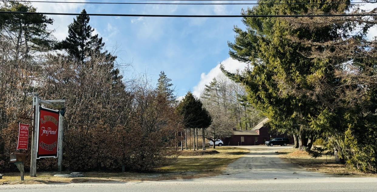 A developer is proposing to build more than 100 new homes and about 40 new townhouses on currently wooded property behind the antiques shop at 502 Post Road in Wells, Maine.