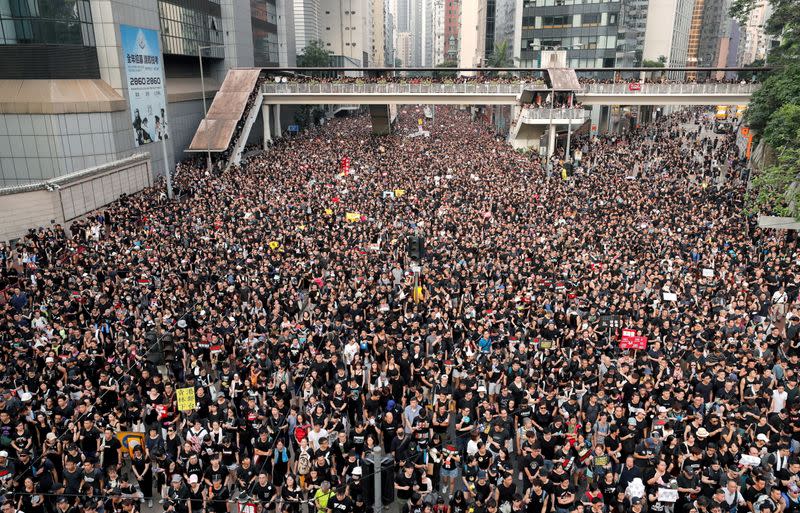 The Wider Image: Leaving Hong Kong: A family makes a wrenching decision