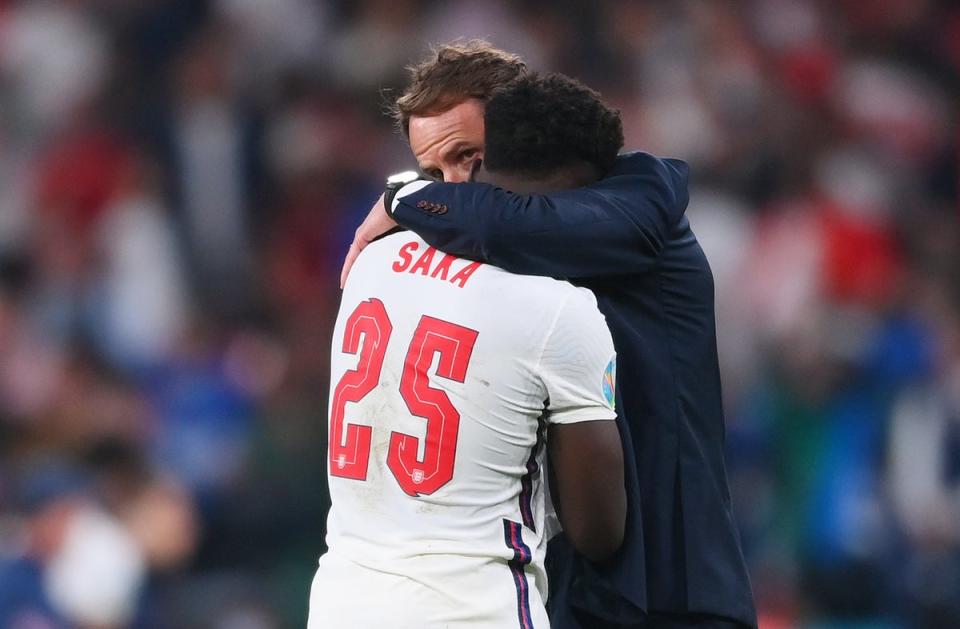 Saka is comforted by England manager Gareth Southgate after missing a penalty in the Euro 2020 final (Getty Images)