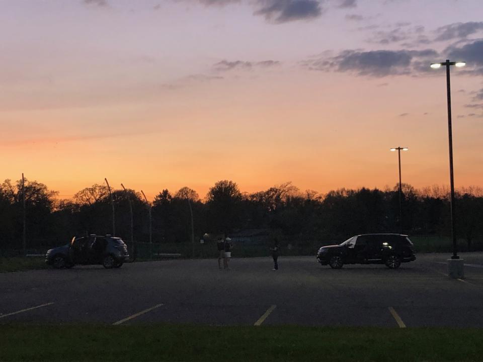 Hours after the Class of 2020 parade ended, Cary-Grove High School staff — who haven't seen each other in months — stuck around just to catch up. (Eric Edholm/Yahoo Sports)