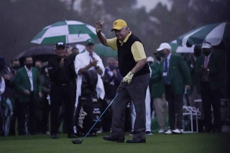 Jack Nicklaus waves after hitting a ceremonial first ball before the first round of the Masters golf tournament Thursday, Nov. 12, 2020, in Augusta, Ga. (AP Photo/David J. Phillip)