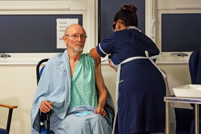 "Bill" William Shakespeare, 81, receives the Pfizer/BioNTech COVID-19 vaccine at University Hospital in Coventry