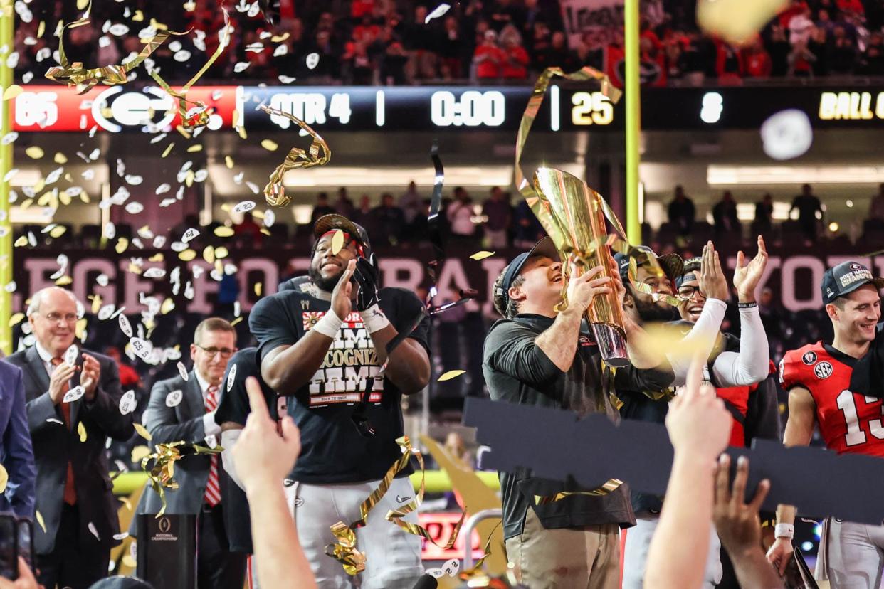 FILE - Georgia coach Kirby Smart celebrates with the trophy after the NCAA College Football National Championship game between TCU and Georgia on Monday, Jan. 9, 2023, in Inglewood, Calif. Georgia won 65 - 7 against TCU.