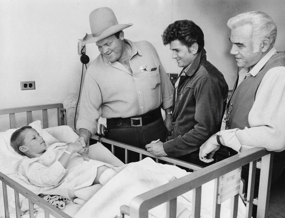 “Bonanza” stars Dan Blocker, Michael Landon and Lorne Greene meet Akron Children’s Hospital patient Bobby Savage, 8,  during a special appearance for the All-American Soap Box Derby in 1962. Bobby was in the hospital with a broken leg.