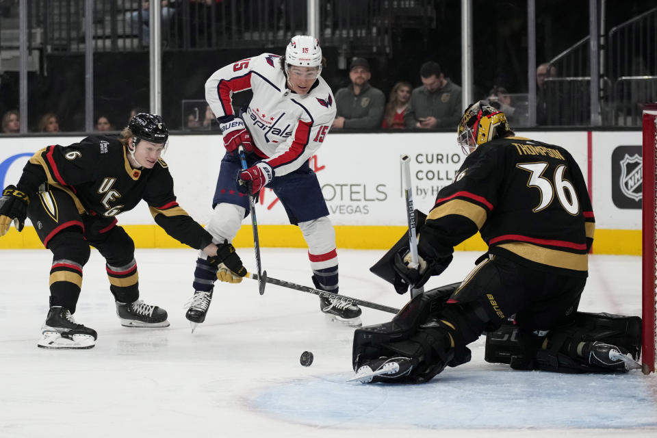 Washington Capitals left wing Sonny Milano (15) attempts a shot on Vegas Golden Knights goaltender Logan Thompson (36) during the first period of an NHL hockey game Saturday, Jan. 21, 2023, in Las Vegas. (AP Photo/John Locher)