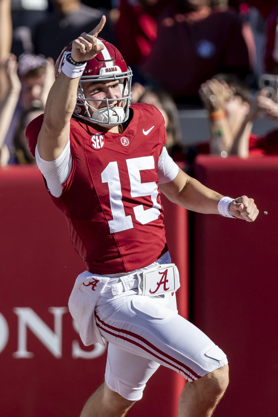 Alabama quarterback Ty Simpson (15) celebrates a touchdown run during the second half of an NCAA college football game against Chattanooga, Saturday, Nov. 18, 2023, in Tuscaloosa, Ala. On review, replay showed Simpson dropping the ball before the goal line, turning the ball over to Chattanooga. (AP Photo/Vasha Hunt)