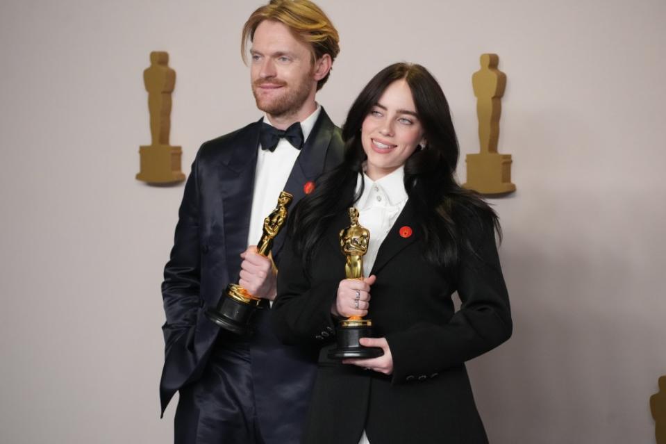 Billie Eilish and her brother Finneas O’Connell, winners of the Oscar for Best Original Song for ‘What Was I Made For?’ from “Barbie”, wore red pins to support a ceasefire. FilmMagic