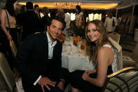 Bradley Cooper and Jennifer Lawrence attend the Hollywood Foreign Press Association's 2012 Installation Luncheon held at the Beverly Hills Hotel on August 9, 2012.