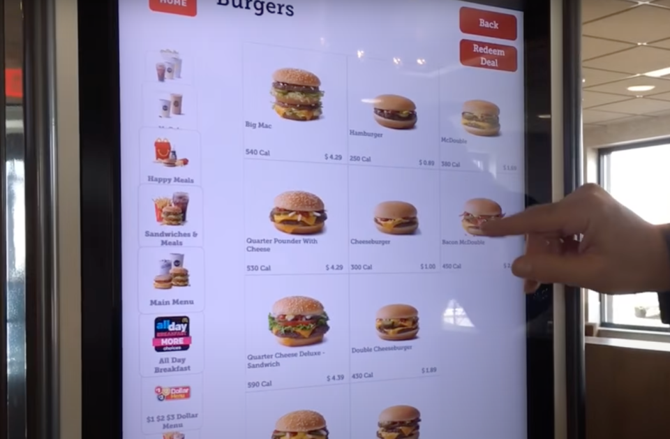 finger scrolling through the touch screen menu