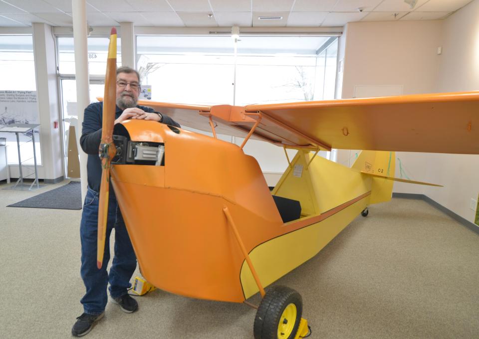 Keith Young is the interim executive director of the Massachusetts Air and Space Museum. He was photographed by a replica of a 1929 Aeronca C-2. The museum has moved to 438 Main St. in Hyannis.