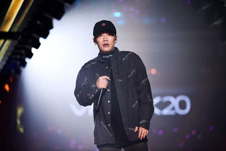 Chinese rap singer Wang Hao, better known by his stage name PG One, performs during a New Year concert in Guangzhou, Guangdong province, China January 1, 2018. Picture taken January 1, 2018. REUTERS/Stringer