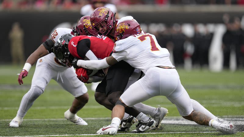Cincinnati running back Myles Montgomery gets corralled by Iowa State defenders Oct. 14, 2023, in Cincinnati. The Cyclones and BYU Cougars meet Saturday in Provo with both teams hoping to become bowl eligible.