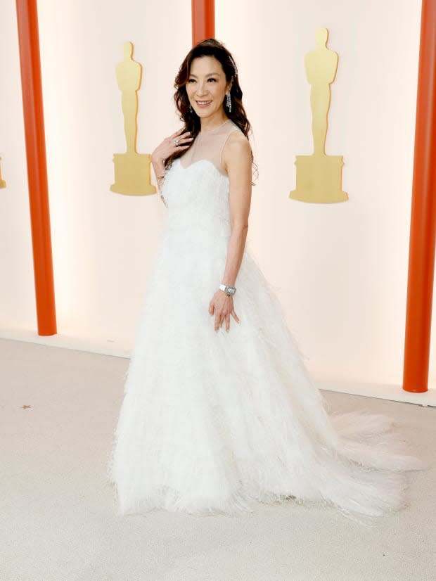 <p>History-making actress Michelle Yeoh was an angelic vision in a Dior Couture gown of flowing white at the 2023 Oscars where she collected the Best Actress award. </p><p><a href="https://www.gettyimages.com/detail/news-photo/michelle-yeoh-attends-the-95th-annual-academy-awards-on-news-photo/1473069226" rel="nofollow noopener" target="_blank" data-ylk="slk:Mike Coppola/Getty Images;elm:context_link;itc:0;sec:content-canvas" class="link ">Mike Coppola/Getty Images</a></p>