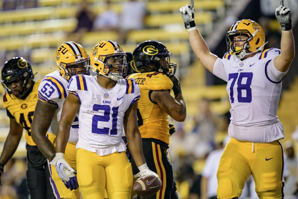 LSU running back Noah Cain (21) celebrates a touchdown against Grambling State with offensive lineman Mason Lunsford (78) during an NCAA college football game in Baton Rouge, La., Saturday, Sept. 9, 2023. (AP Photo/Matthew Hinton)