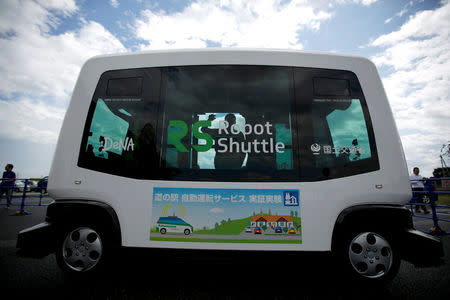 Robot Shuttle, a driver-less, self driving bus, developed by Japan's internet commerce and mobile games provider DeNA Co., is parked during an experimental trial with a self-driving bus in a community in Nishikata town, Tochigi Prefecture, Japan September 8, 2017. Picture taken September 8, 2017. REUTERS/Issei Kato