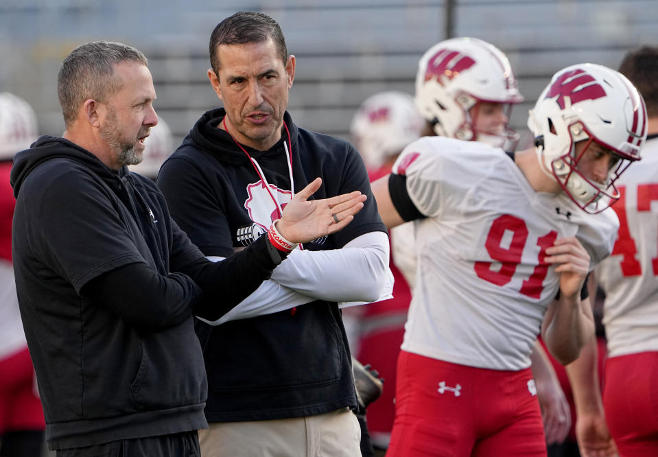 Apr 11, 2023; Madison, WI, USA; Wisconsin defensive coordinator Mike Tressel, left, talks with head coach Luke Fickell during practice Tuesday, April 11, 2023 at Camp Randall Stadium in Madison, Wis. Mandatory Credit: Mark Hoffman-USA TODAY Sports