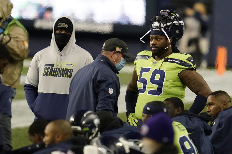 Seattle Seahawks defensive tackle Damon Harrison (59) stands on the sideline during the first half of an NFL football game against the Arizona Cardinals, Thursday, Nov. 19, 2020, in Seattle. (AP Photo/Elaine Thompson)