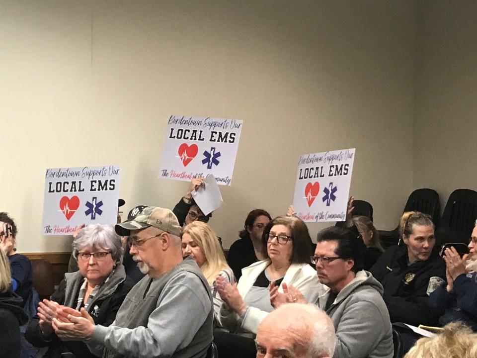 Image: Audience Applauds Speakers At Bordentown Twp Meeting On EMS Privatization Vote
Audience at the Bordentown Township meeting Monday night , March 27, 2023, applaud and wave signs as one of many speakers against hiring Robert Wood Johnson and Barnabas EMS to replace township EMS workers