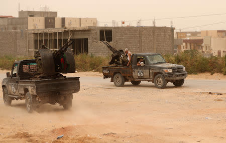 Members of the the Libyan internationally recognised government forces take position during the fighting with the Eastern forces in Ain Zara, in Tripoli, Libya April 21, 2019. REUTERS/Ahmed Jadallah