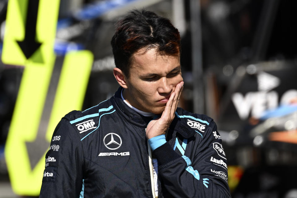 Williams driver Alexander Albon of Thailand walks on the pit lane during the qualifying session ahead of Sunday's Formula One Dutch Grand Prix auto race, at the Zandvoort racetrack, in Zandvoort, Netherlands, Saturday, Sept. 3, 2022. (Christian Bruna/Pool via AP)