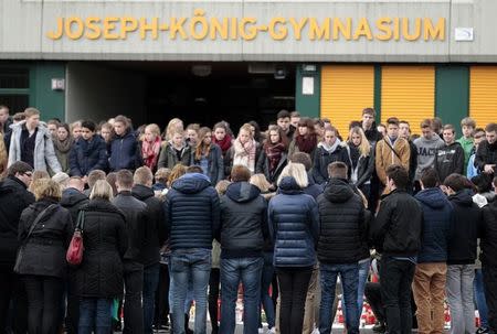 Students of Joseph-Koenig-Gymnasium high school hold a minute of silence outside their school in Haltern am See, March, 26, 2015. REUTERS/Ina Fassbender