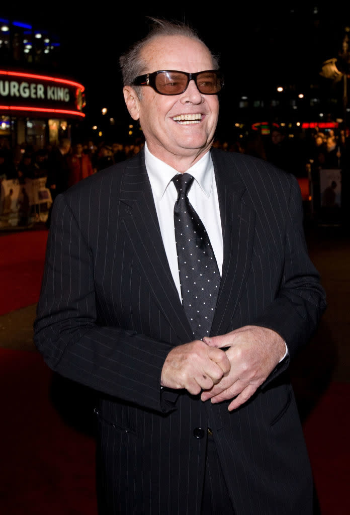 Close-up of Jack in a pin-striped suit and tie and smiling