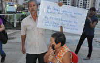 Disgruntled rallygoers bring along home made signs