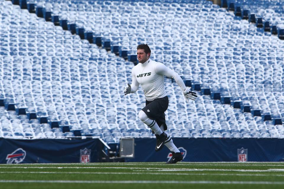 Tim Tebow #15 of the New York Jets warms up before an NFL game against the Buffalo Bills at Ralph Wilson Stadium on December 30, 2012 in Orchard Park, New York. (Photo by Tom Szczerbowski/Getty Images)