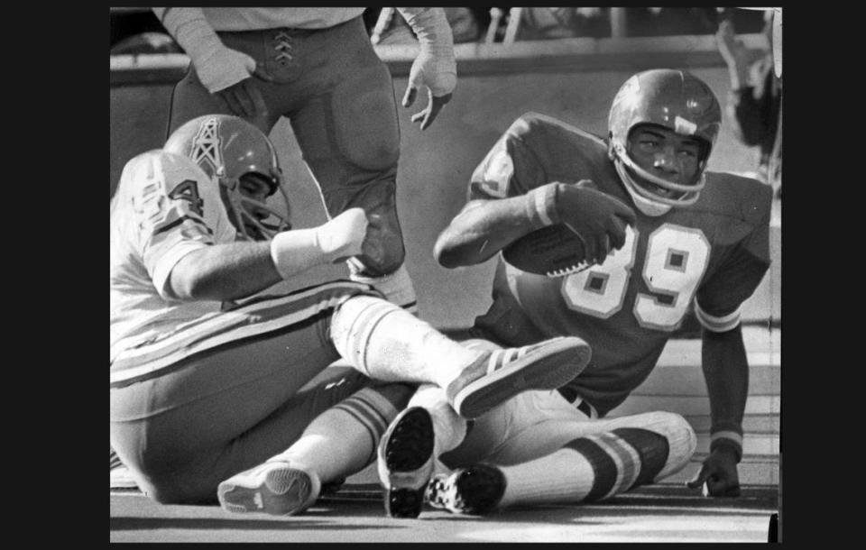 Kansas City Chiefs receiver Otis Taylor, right, had toughness, speed and elusive moves during his days as a star pass-catching target for KC’s pro football juggernaut.