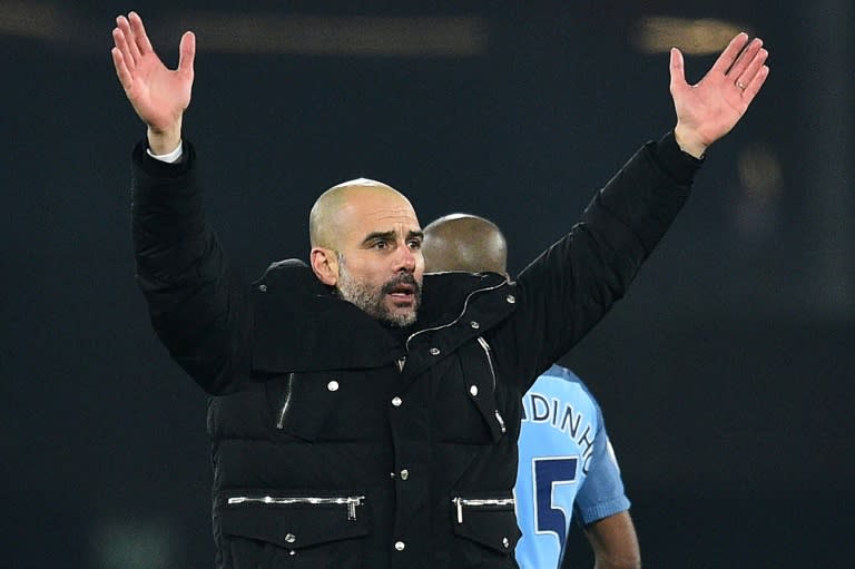 Manchester City's Spanish manager Pep Guardiola celebrates on the pitch after the English Premier League football match between Bournemouth and Manchester City at the Vitality Stadium in Bournemouth, southern England on February 13, 2017