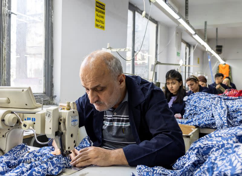 Employees work at a textile factory in Istanbul