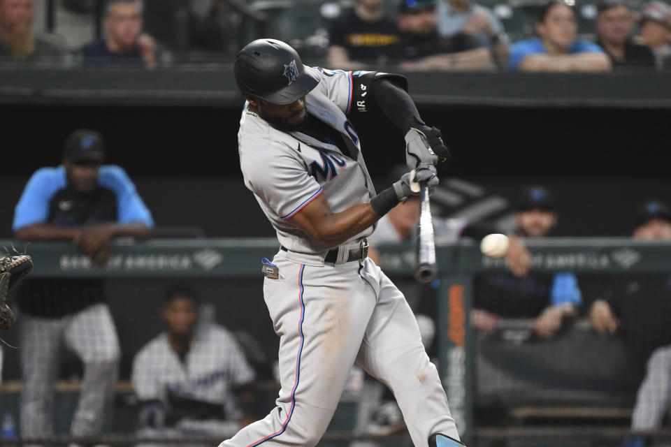 Miami Marlins' Starling Marte hits an RBI single during the fourth inning off Baltimore Orioles starting pitcher Spenser Watkins in a baseball game Tuesday, July 27, 2021, in Baltimore. (AP Photo/Terrance Williams)