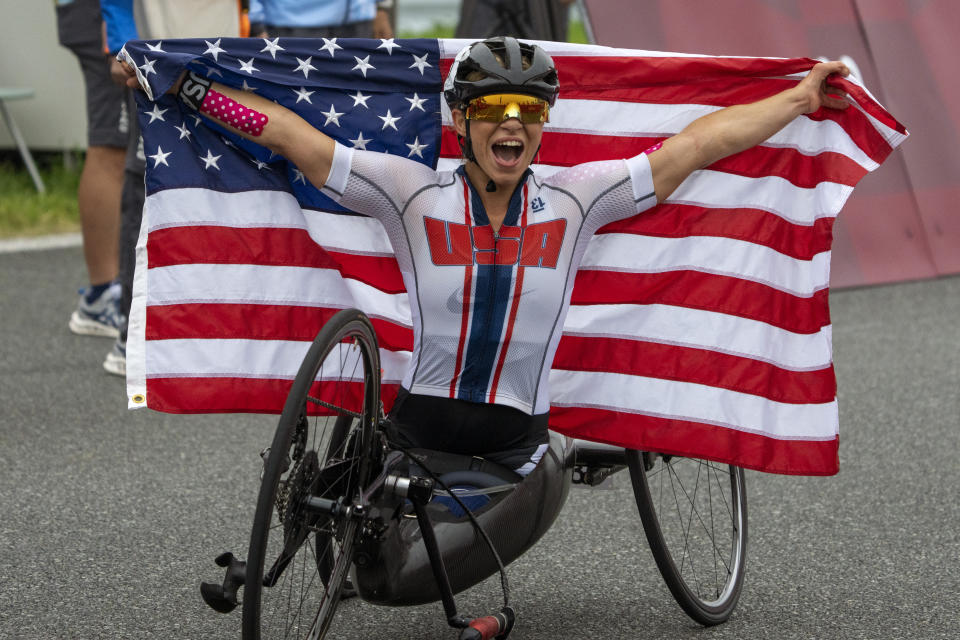 Oksana Masters, from USA, celebrates after wining at Women's H5 Road Race at the Fuji International Speedway at the Tokyo 2020 Paralympic Games, Wednesday, Sept. 1, 2021, in Tokyo, Japan. (AP Photo/Emilio Morenatti)