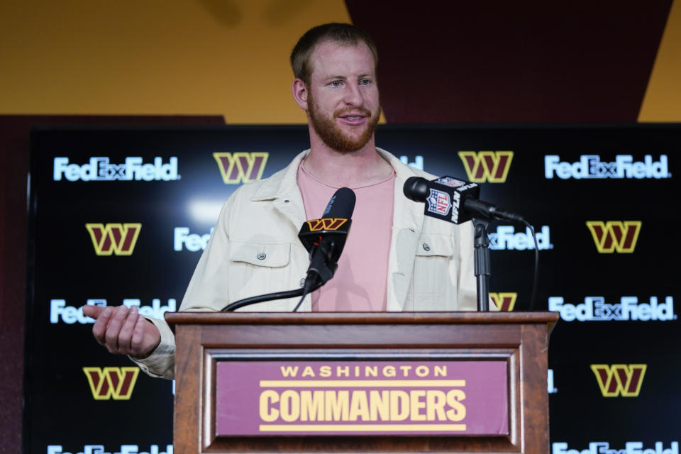 Washington Commanders quarterback Carson Wentz (11) speaks to members of the media during a news conference at the end of of an NFL football game against the Jacksonville Jaguars, Sunday, Sept. 11, 2022, in Landover, Md. Washington won 28-22. (AP Photo/Alex Brandon)