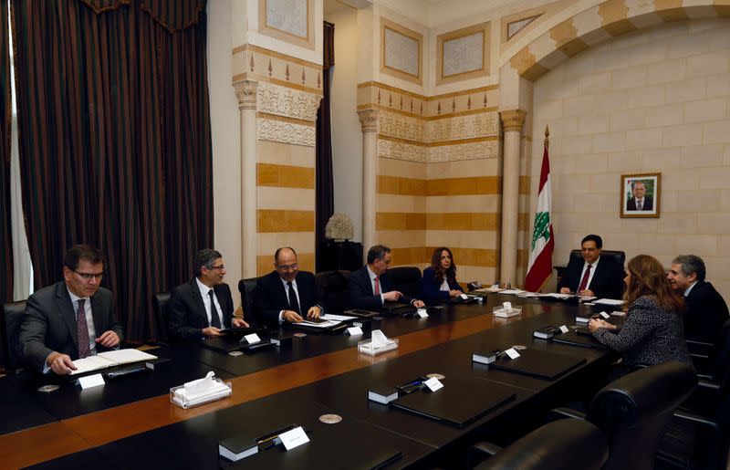 Lebanese Prime Minister Hassan Diab and officials meet with a team of IMF experts at the government palace in Beirut