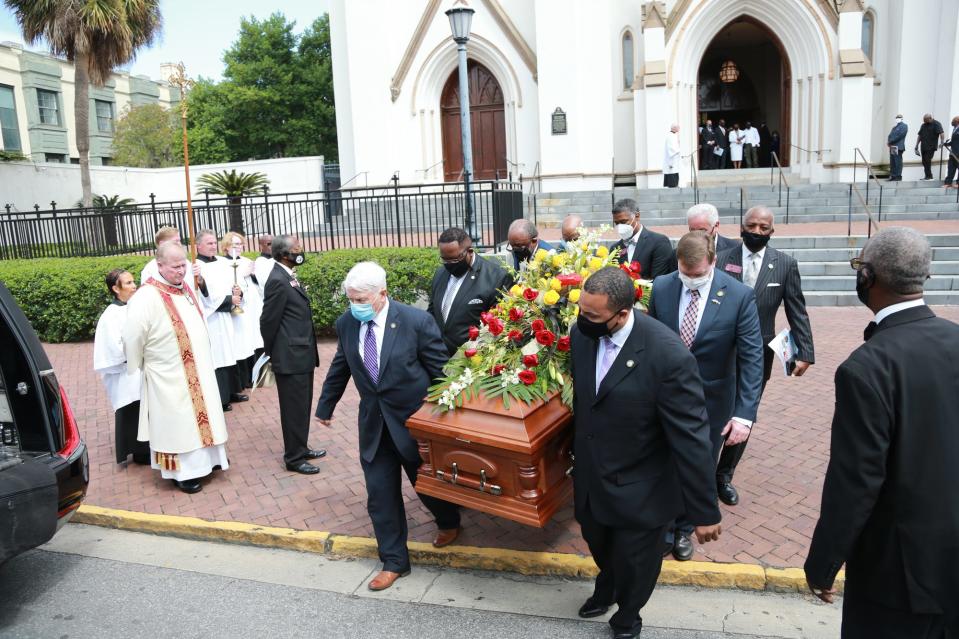 Pallbearers from the Chatham County legislative delegation carry the casket of Georgia House Representative Edward "Mickey" Stephens following his funeral service at the Cathedral Basilica of St. John the Baptist.