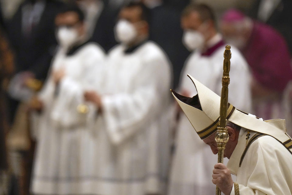 Pope Francis holds his pastoral staff as he celebrates Christmas Eve Mass, at St. Peter's Basilica, at the Vatican, Friday Dec. 24, 2021. (AP Photo/Alessandra Tarantino)