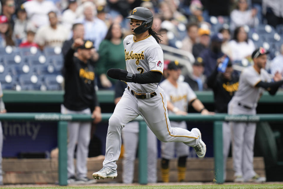 Pittsburgh Pirates' Connor Joe scores a run on Miguel Andujar's single in the second inning of the first baseball game of a doubleheader against the Washington Nationals, Saturday, April 29, 2023, in Washington. (AP Photo/Patrick Semansky)