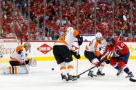 Apr 22, 2016; Washington, DC, USA; Philadelphia Flyers goalie Michal Neuvirth (30) makes a save on Washington Capitals center Jay Beagle (83) in the first period in game five of the first round of the 2016 Stanley Cup Playoffs at Verizon Center. Mandatory Credit: Geoff Burke-USA TODAY Sports