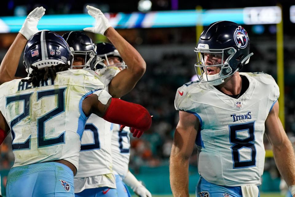 Tennessee Titans quarterback Will Levis (8) looks on as running back Derrick Henry (22) celebrates his touchdown against the Miami Dolphins during the fourth quarter at Hard Rock Stadium.