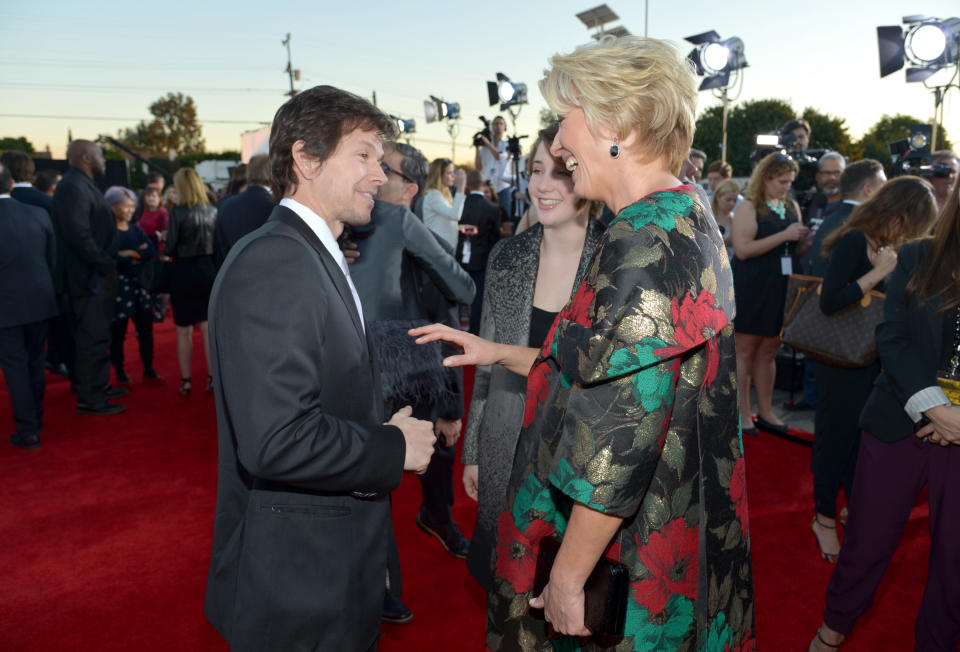 From left, Mark Wahlberg, Gaia Romilly Wise, and Emma Thompson arrive at the 19th annual Critics' Choice Movie Awards at the Barker Hangar on Thursday, Jan. 16, 2014, in Santa Monica, Calif. (Photo by John Shearer/Invision/AP)