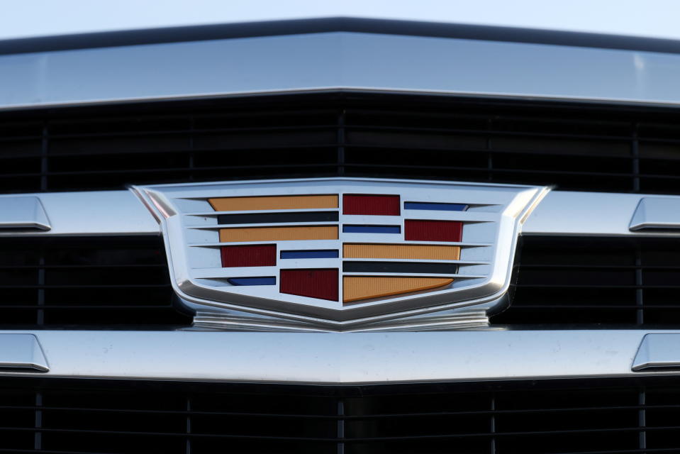 A badge of Cadillac, an automobile brand owned by General Motors Company, is seen on the grill of a vehicle for sale at a car dealership in Queens, New York, U.S., November 16, 2021. REUTERS/Andrew Kelly